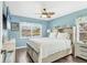 Bright bedroom with wood floors, ceiling fan, and water view at 2418 Herron Ter, Port Charlotte, FL 33981