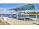 A private boat lift displays the capabilities of a luxury waterfront home at 2418 Herron Ter, Port Charlotte, FL 33981