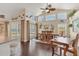 Dining room featuring high ceilings, fan, dark floors, and direct access to the pool and backyard at 2418 Herron Ter, Port Charlotte, FL 33981