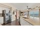 Modern kitchen with stainless steel appliances, granite countertops, and an open layout, perfect for culinary enthusiasts at 2418 Herron Ter, Port Charlotte, FL 33981