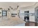 Bright kitchen with white cabinetry, stainless steel appliances, and a spacious island, designed for functionality and style at 2418 Herron Ter, Port Charlotte, FL 33981