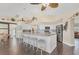Elegant kitchen featuring white cabinets, a large island with seating, and ample counter space, creating a chef's dream at 2418 Herron Ter, Port Charlotte, FL 33981