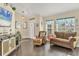 Cozy living room provides ample natural light, comfortable seating, and stylish decor at 2418 Herron Ter, Port Charlotte, FL 33981