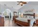 Spacious main bedroom features a ceiling fan, vaulted ceiling, and access to the main bathroom at 2418 Herron Ter, Port Charlotte, FL 33981