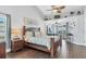 Spacious main bedroom features a ceiling fan, vaulted ceiling, and backyard access at 2418 Herron Ter, Port Charlotte, FL 33981