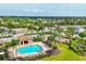 Aerial view of community featuring pool, playground, and beautiful landscaping at 2572 Sherman Oak Dr, North Port, FL 34289