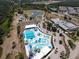 Beautiful aerial view showcasing the community pool, lakes, and surrounding area at 2572 Sherman Oak Dr, North Port, FL 34289