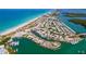 Aerial view of the beachfront community with boats, docks, and blue water at 2572 Sherman Oak Dr, North Port, FL 34289