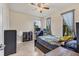 Bedroom with tile floors, a ceiling fan and room for a desk and bed at 2572 Sherman Oak Dr, North Port, FL 34289