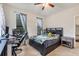 This bedroom offers tile flooring, a ceiling fan and good natural light at 2572 Sherman Oak Dr, North Port, FL 34289
