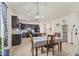 This eat-in kitchen has dark cabinets and flows into an open concept living space at 2572 Sherman Oak Dr, North Port, FL 34289