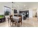 This open concept eat-in kitchen has dark cabinets, tile floors and an island with a breakfast bar at 2572 Sherman Oak Dr, North Port, FL 34289