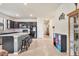 Stylish kitchen with dark cabinetry, granite countertops, and a spacious breakfast bar at 2572 Sherman Oak Dr, North Port, FL 34289