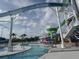 Waterslides at community pool area with splash area and lifeguard chair at 2572 Sherman Oak Dr, North Port, FL 34289
