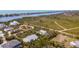 Stunning aerial view of a neighborhood with waterfront access and lush, green surroundings at 2760 Lemon Ave, Englewood, FL 34223