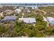 Lovely aerial of a neighborhood with many different styles of single Gathering homes at 2760 Lemon Ave, Englewood, FL 34223