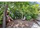 Secluded backyard space features mature trees and landscaping at 2760 Lemon Ave, Englewood, FL 34223