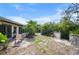 Backyard features seating area, patio, and mature landscaping at 2760 Lemon Ave, Englewood, FL 34223