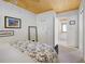 Bright bedroom with neutral decor, wood ceiling, and view of ensuite bathroom at 2760 Lemon Ave, Englewood, FL 34223