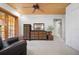 Bright bedroom featuring wood ceiling, carpet flooring, a dresser, and closet access at 2760 Lemon Ave, Englewood, FL 34223