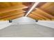 Spacious bonus room with vaulted wood ceiling and neutral carpet, perfect for a variety of uses at 2760 Lemon Ave, Englewood, FL 34223