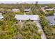 Beautiful single Gathering home featuring meticulous landscaping, a metal roof and an attached garage at 2760 Lemon Ave, Englewood, FL 34223