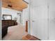 Hallway featuring wood ceiling, carpet flooring, and two closets leading to other rooms at 2760 Lemon Ave, Englewood, FL 34223