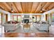Bright living room features vaulted ceilings, ceiling fans, fireplace, tile flooring and plenty of natural light at 2760 Lemon Ave, Englewood, FL 34223