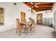 Inviting patio area with rustic wooden furniture, a vaulted ceiling, and windows offering pleasant views at 2760 Lemon Ave, Englewood, FL 34223