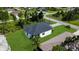 Aerial view of single-Gathering home surrounded by trees and greenery in a residential neighborhood at 280 Antis Dr, Rotonda West, FL 33947