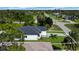 Aerial view of single-Gathering home surrounded by trees, greenery, and a property outline at 280 Antis Dr, Rotonda West, FL 33947
