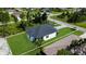 Aerial view of single-Gathering home surrounded by trees, greenery, and a property outline at 280 Antis Dr, Rotonda West, FL 33947