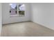Bright bedroom featuring hardwood flooring and a large window with view at 280 Antis Dr, Rotonda West, FL 33947