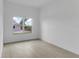 Bright bedroom featuring hardwood flooring and a large window with view at 280 Antis Dr, Rotonda West, FL 33947