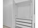 Open closet showcasing drawers, shelving, and clothing rod at 280 Antis Dr, Rotonda West, FL 33947