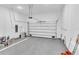 Spacious garage with epoxy flooring, overhead door, and automatic opener at 280 Antis Dr, Rotonda West, FL 33947