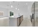 Spacious kitchen island with modern appliances, pendant lighting and an open concept feel at 280 Antis Dr, Rotonda West, FL 33947