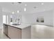 Open living space with tile floors, a kitchen island, and abundant natural light at 280 Antis Dr, Rotonda West, FL 33947