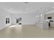 Spacious living area with a kitchen island and natural light streaming through windows and doors at 280 Antis Dr, Rotonda West, FL 33947