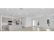 Open concept living room showcasing a modern kitchen and plenty of natural light at 280 Antis Dr, Rotonda West, FL 33947