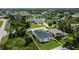 This property showcases the backyard of a new home with modern design and a black roof at 280 Antis Dr, Rotonda West, FL 33947