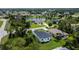 This property showcases the backyard of a new home with modern design and a black roof at 280 Antis Dr, Rotonda West, FL 33947