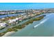 Scenic aerial view of waterfront homes nestled along picturesque waterways with boats, surrounded by lush nature at 310 Kettle Harbor Dr, Placida, FL 33946