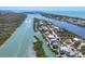 Picturesque aerial view of waterfront properties, featuring a home encircled, nestled along scenic waterways at 310 Kettle Harbor Dr, Placida, FL 33946