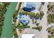 Magnificent aerial view of waterfront homes, showcasing a serene pool and dock along winding waterways at 310 Kettle Harbor Dr, Placida, FL 33946