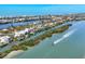 Scenic aerial shot showcasing waterfront homes nestled along picturesque waterways with boats, surrounded by lush nature at 310 Kettle Harbor Dr, Placida, FL 33946