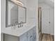 Modern bathroom with a large mirror and a marble countertop vanity at 310 Kettle Harbor Dr, Placida, FL 33946