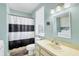Bathroom and laundry room featuring a tub with shower and a washer and dryer at 310 Kettle Harbor Dr, Placida, FL 33946