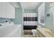 Bathroom and laundry room featuring a tub with shower and a washer and dryer at 310 Kettle Harbor Dr, Placida, FL 33946