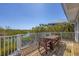 Inviting wooden deck with table set offering scenic views of the water and lush greenery at 310 Kettle Harbor Dr, Placida, FL 33946